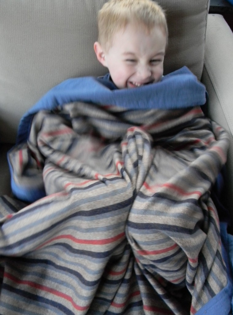 snuggly guy in stripy blanket