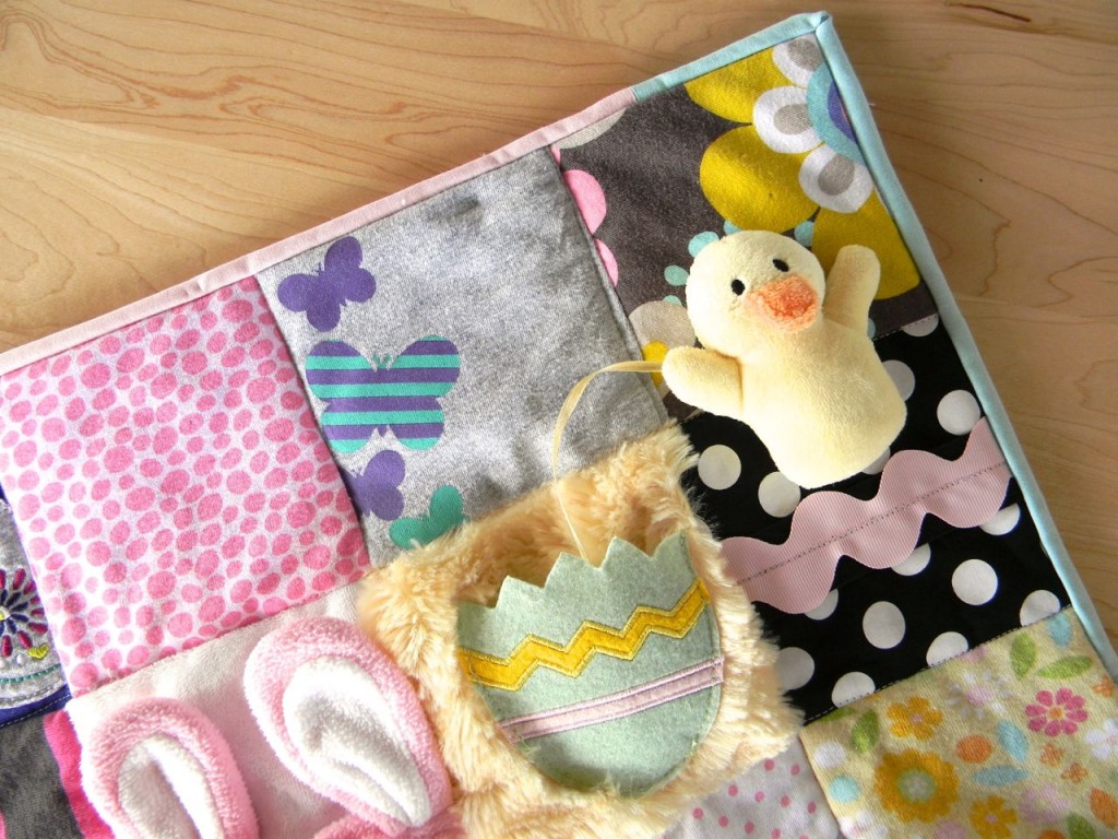 removable duck on baby clothes quilt